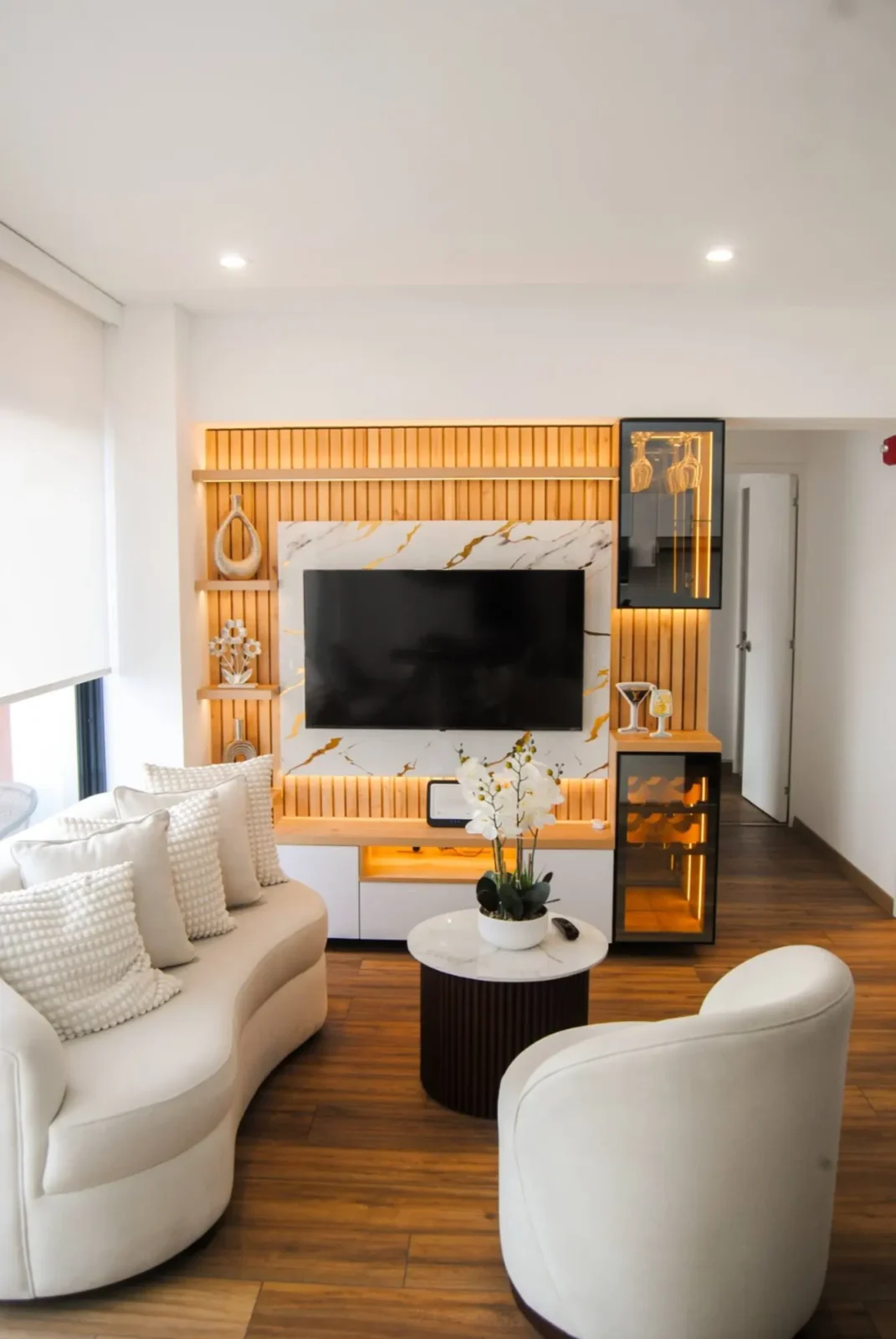 Living room with curved sofa and swivel chairs